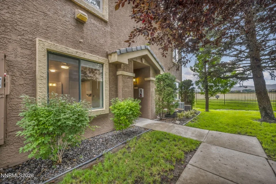 900 South Meadows Parkway APT 4514 - Front Exterior View – Side-angle view of the front of the condo showcasing the exterior, entryway, and welcoming curb appeal.